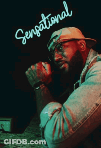 Man In Front Of Sensational Neon Sign GIF