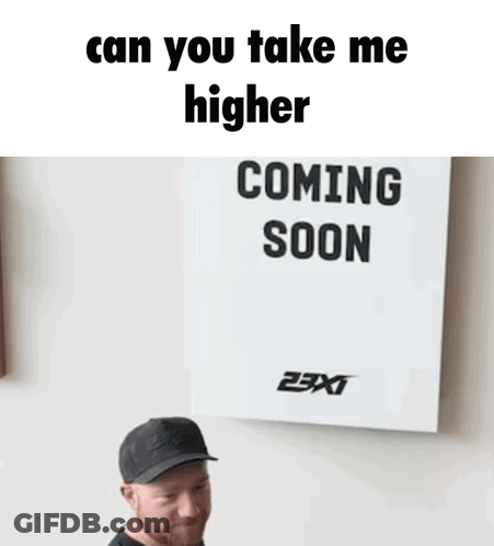 Man In Front Of Sign Saying Can You Take Me Higher Coming Soon GIF