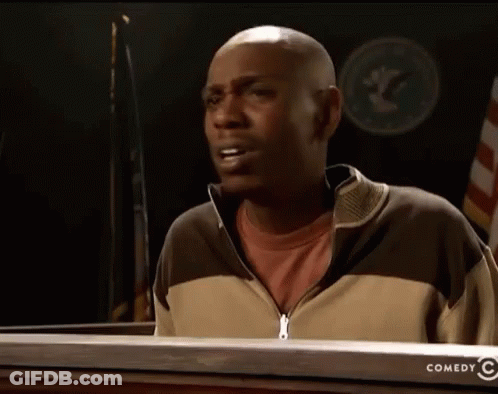 Man In Front Of Sign Saying Comedy GIF