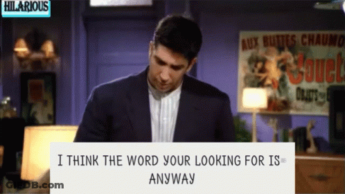 Man In Front Of Sign Saying Hilarious GIF