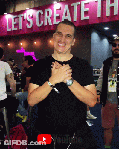 Man In Front Of Sign Saying Let 'S Create The GIF