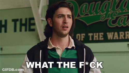 Man In Front Of Sign Saying What The F*ck GIF