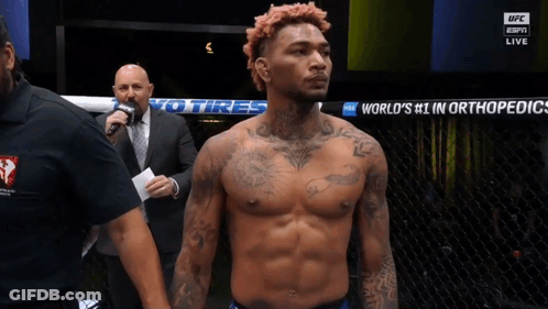 Man In Front Of Sign Saying World's Number 1 In Orthopedics GIF