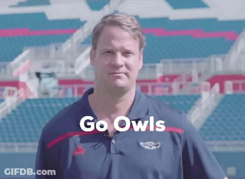 Man In Front Of Stadium Saying Go Owls GIF