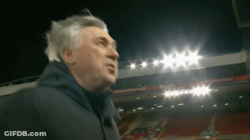 Man In Front Of Stadium With Lights On GIF