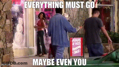 Man In Front Of Store With Pimps & Hots Christmas Sale Sign GIF