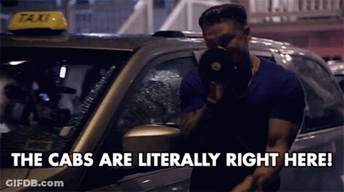 Man In Front Of Taxi Saying The Cabs Are Literally Right Here GIF