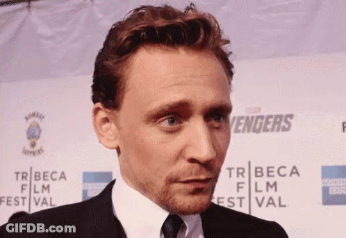 Man In Front Of Tribeca Film Festival Sign GIF