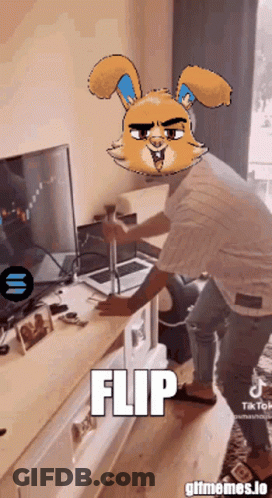 Man In Front Of TV With Cartoon Bunny And Word Flip GIF