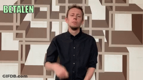 Man In Front Of Wall Saying Betalen GIF