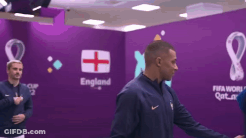 Man In Front Of Wall Saying England GIF