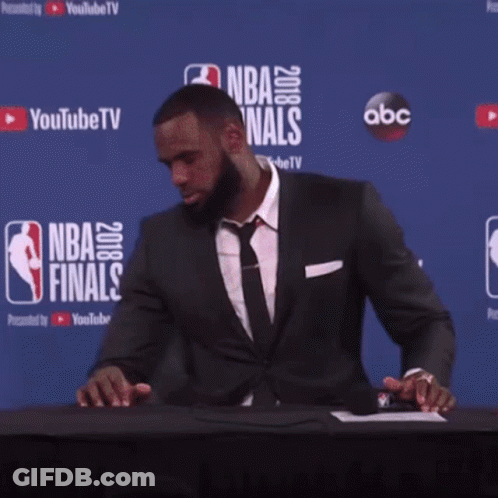 Man In Front Of Wall Saying NBA Finals GIF