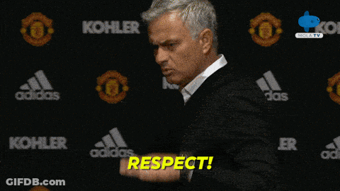 Man In Front Of Wall With Kohler And Adidas Logos GIF