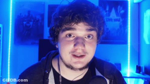 Man In Front Of Wall With Live Wild Poster GIF