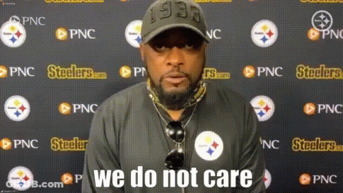 Man In Front Of Wall With Steelers Logos GIF