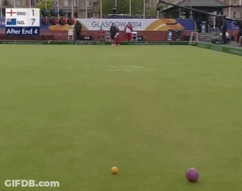 Man In Front Of Wealth Games Sign GIF