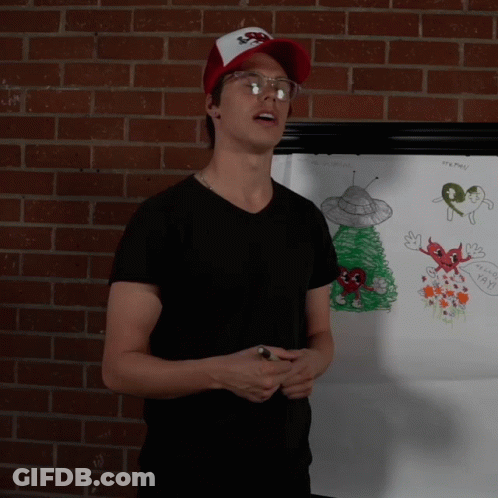 Man In Front Of White Board With X-Files Drawing GIF
