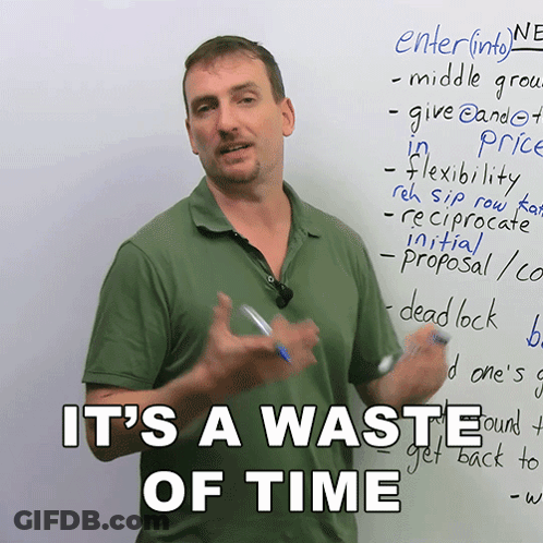 Man In Front Of Whiteboard Saying It's A Waste Of Time GIF