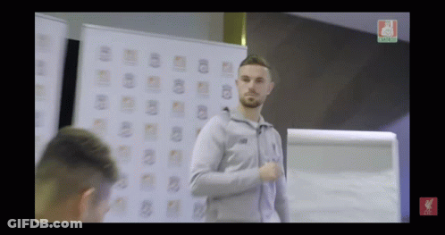 Man In Front Of Whiteboard With Liverpool Logo GIF