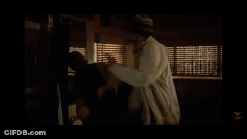 Man In Front Of Window With Blinds GIF