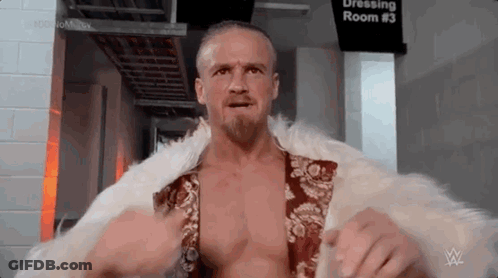 Man In Fur Coat And Beard In Dressing Room GIF