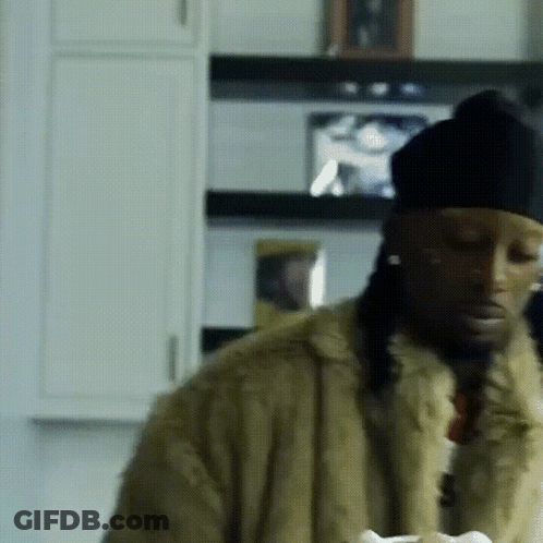 Man In Fur Coat And Black Hat GIF