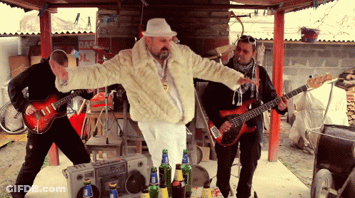 Man In Fur Coat At Danger Sign GIF
