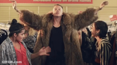 Man In Fur Coat Dancing With Two Women GIF