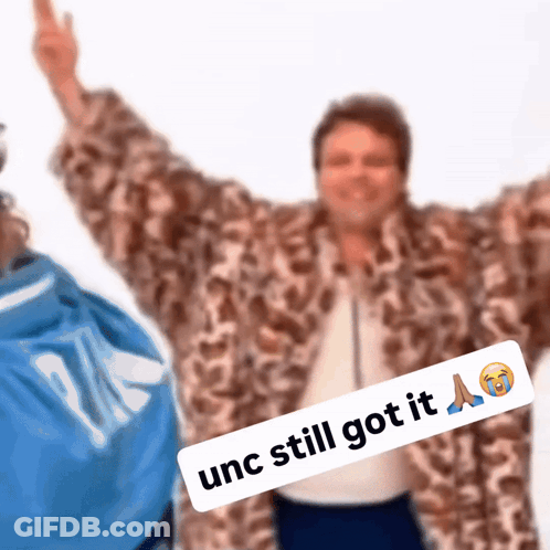 Man In Fur Coat Giving Middle Finger Saying UNC Still Got It GIF