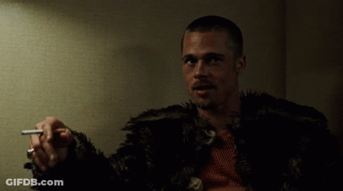Man In Fur Coat Holding Cigarette GIF