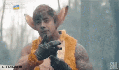 Man In Fur Coat Holding Gun GIF