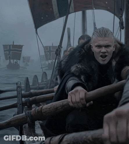 Man In Fur Coat Rowing Boat GIF