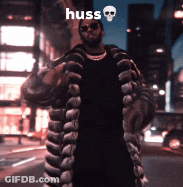 Man In Fur Coat Saying Huss GIF