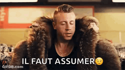 Man In Fur Coat Saying Il Faut Assumer GIF