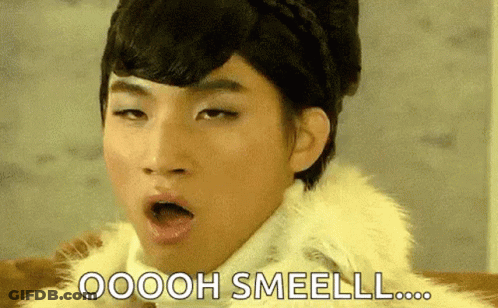 Man In Fur Coat Says Oooh Smeell GIF