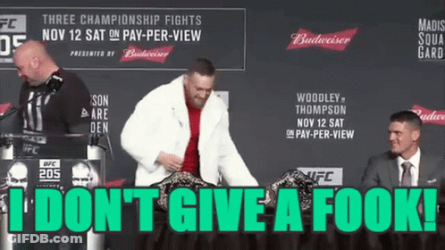 Man In Fur Coat Standing At Podium GIF