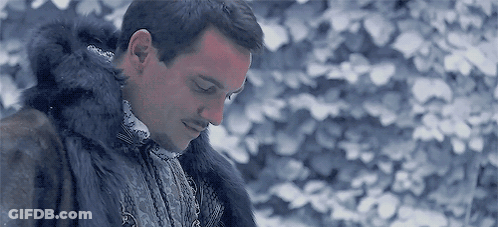 Man In Fur Coat Standing In Snow With Eyes Closed GIF