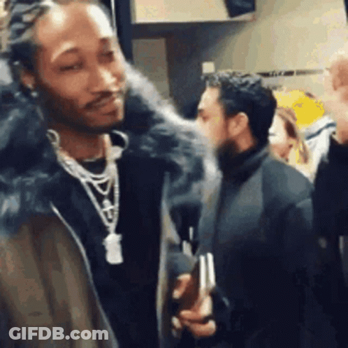 Man In Fur Coat Talking To Crowd GIF