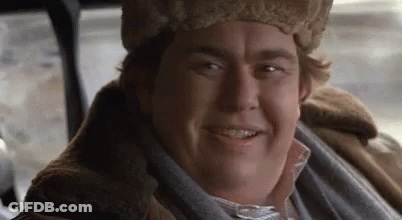 Man In Fur Hat And Fur Coat Smiling GIF