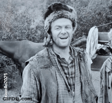 Man In Fur Hat And Plaid Shirt Smiling Black And White GIF