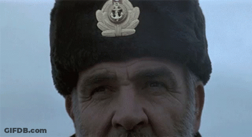 Man In Fur Hat With Anchor GIF