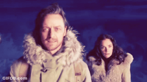 Man In Fur Hooded Jacket Next To Woman GIF