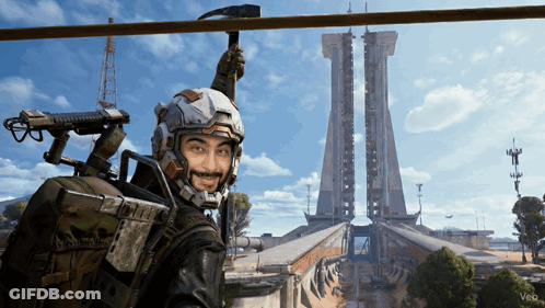 Man In Futuristic Helmet Standing In Front Of Building GIF