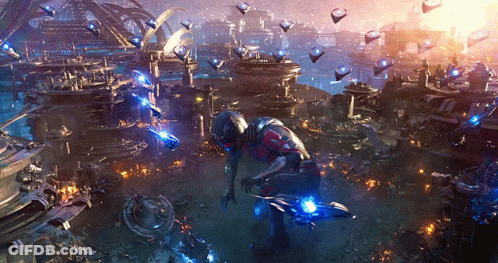 Man In Futuristic Suit Before Futuristic City GIF