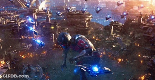 Man In Futuristic Suit In Front Of City GIF
