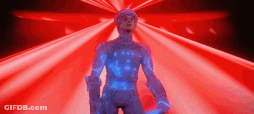 Man In Futuristic Suit Standing In Front Of Red Background GIF
