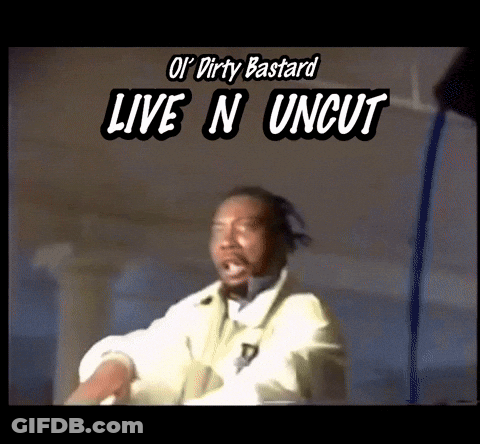 Man In Futuristic Suit Walking Across Bridge With Mountains GIF