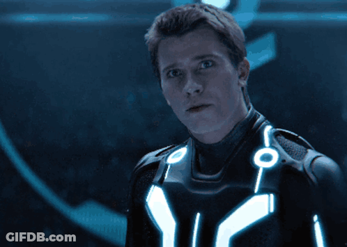 Man In Futuristic Suit With Glowing Chest Circles GIF