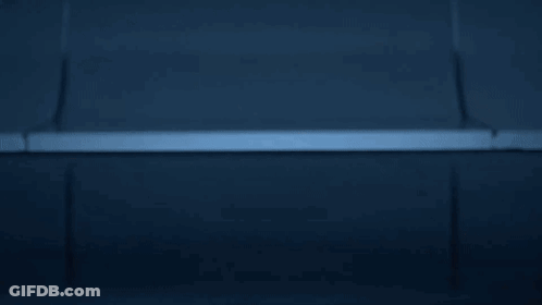 Man In Futuristic Suit With Glowing Circles On Chest GIF
