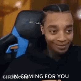 Man In Gaming Chair With Blue Tie Smiling GIF